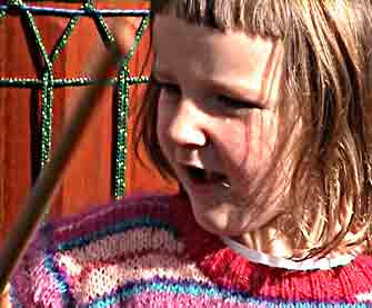 Image - young girl exploring drums and drumming